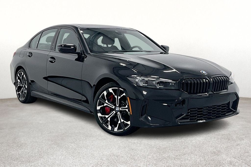 2026 BMW 3 Series 330i xDrive in Black Sapphire Metallic — front three-quarter view