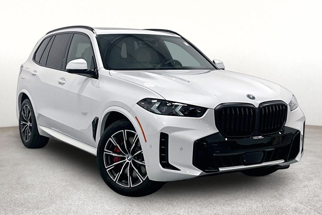 2026 BMW X5 xDrive50e in Mineral White Metallic — front three-quarter view