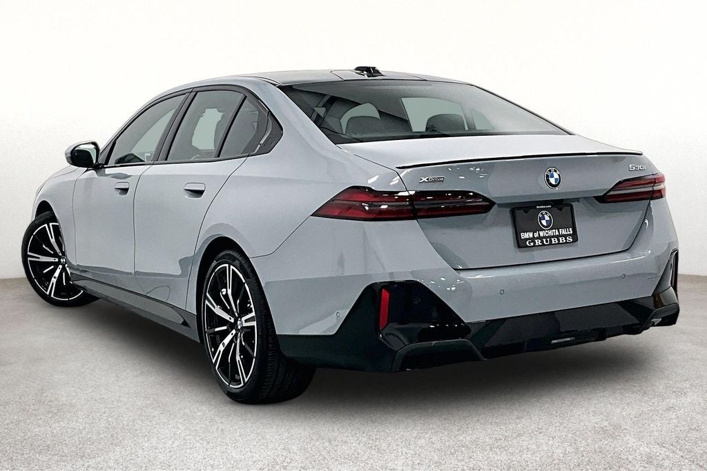 2027 BMW 5 Series — rear three-quarter view