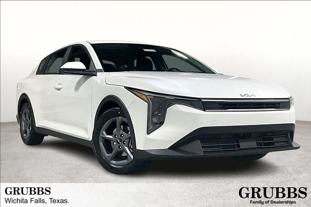 2026 Kia K4 LXS in Snow White Pearl — front three-quarter view
