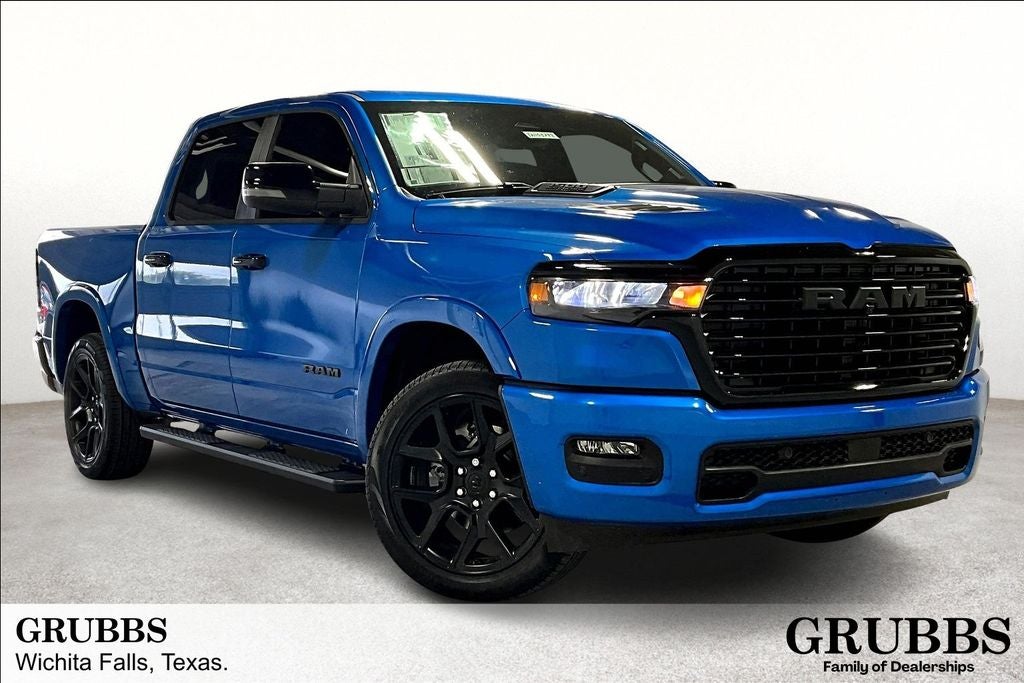 2026 RAM Ram 1500 RAM 1500 LARAMIE CREW CAB 4X4 5'7' BOX in Hydro Blue Pearl-Coat Exterior Paint — front three-quarter view