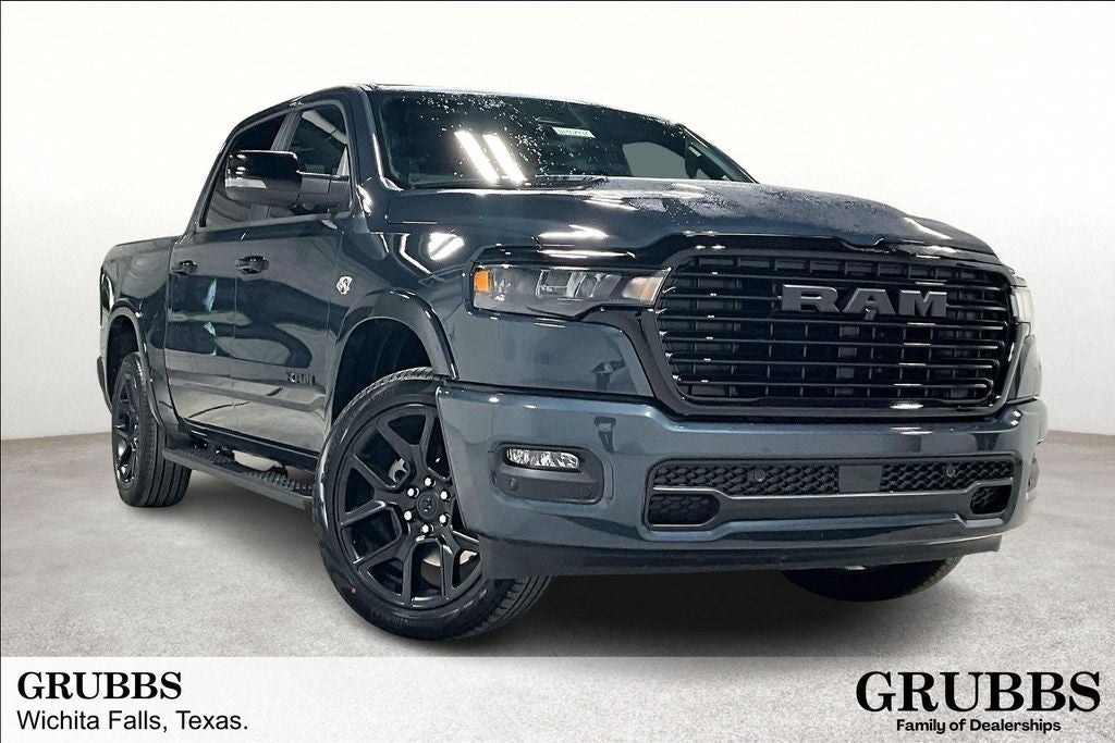 2026 RAM 1500 Laramie in Forged Blue Metallic — front three-quarter view