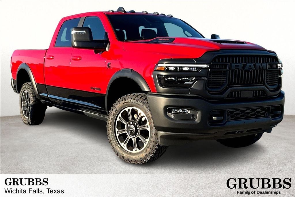 2026 RAM Ram 2500 RAM 2500 REBEL CREW CAB 4X4 6'4' BOX in Flame Red Clear-Coat Exterior Paint — front three-quarter view